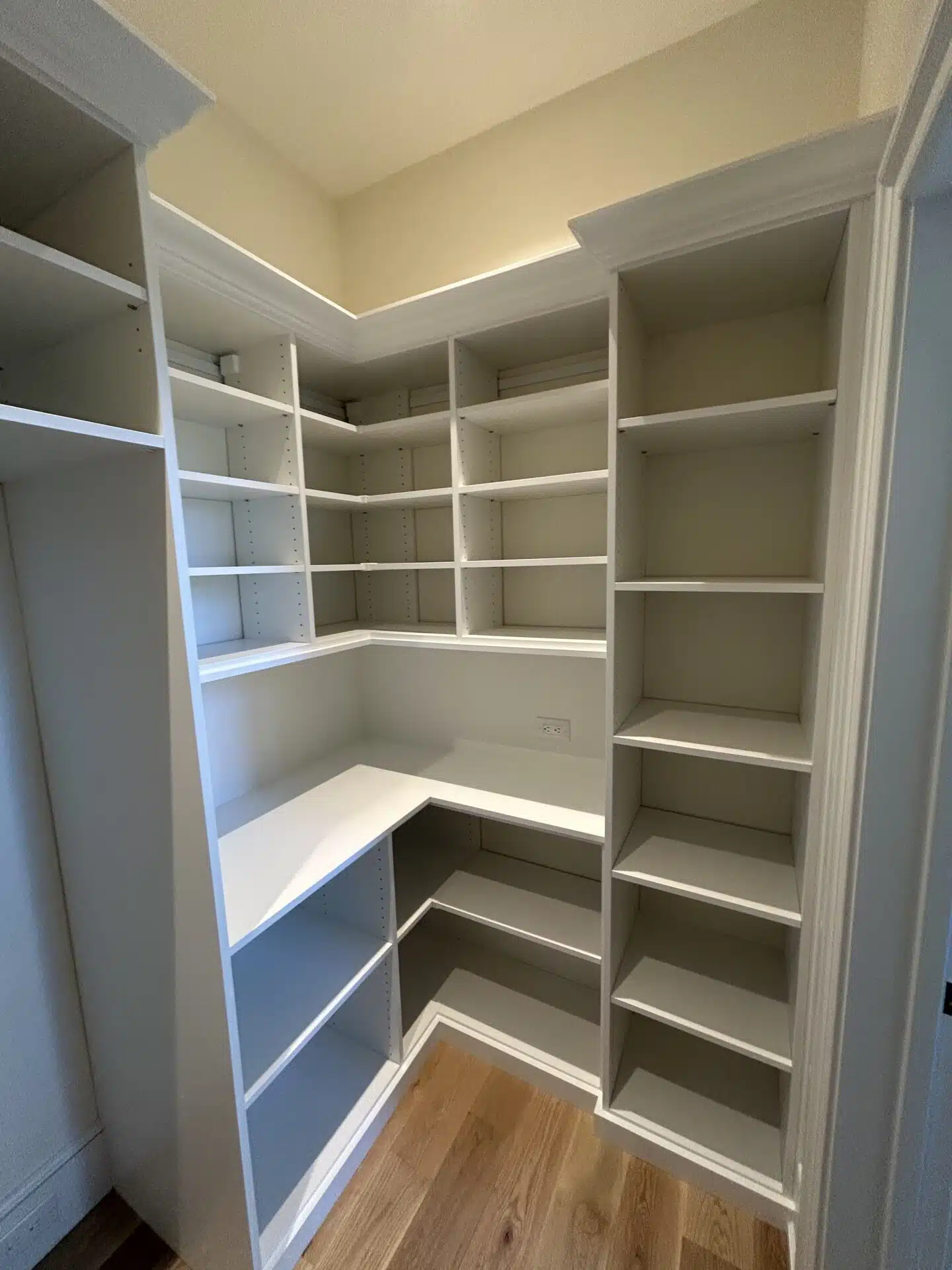 Custom white closet and pantry shelving system
