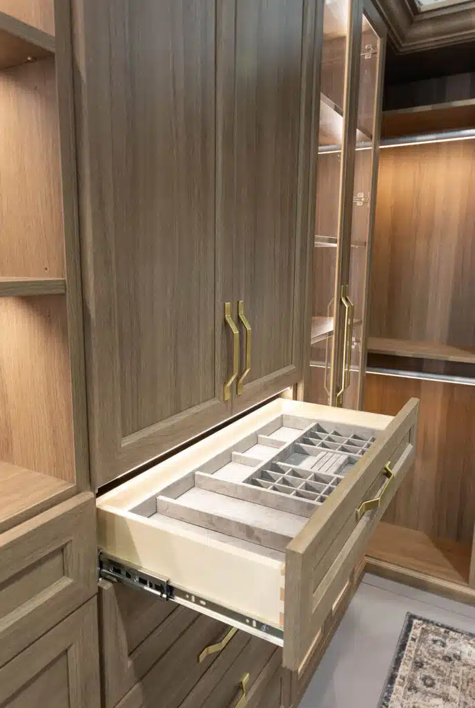 Bespoke wood walk-in closet with gold hardware